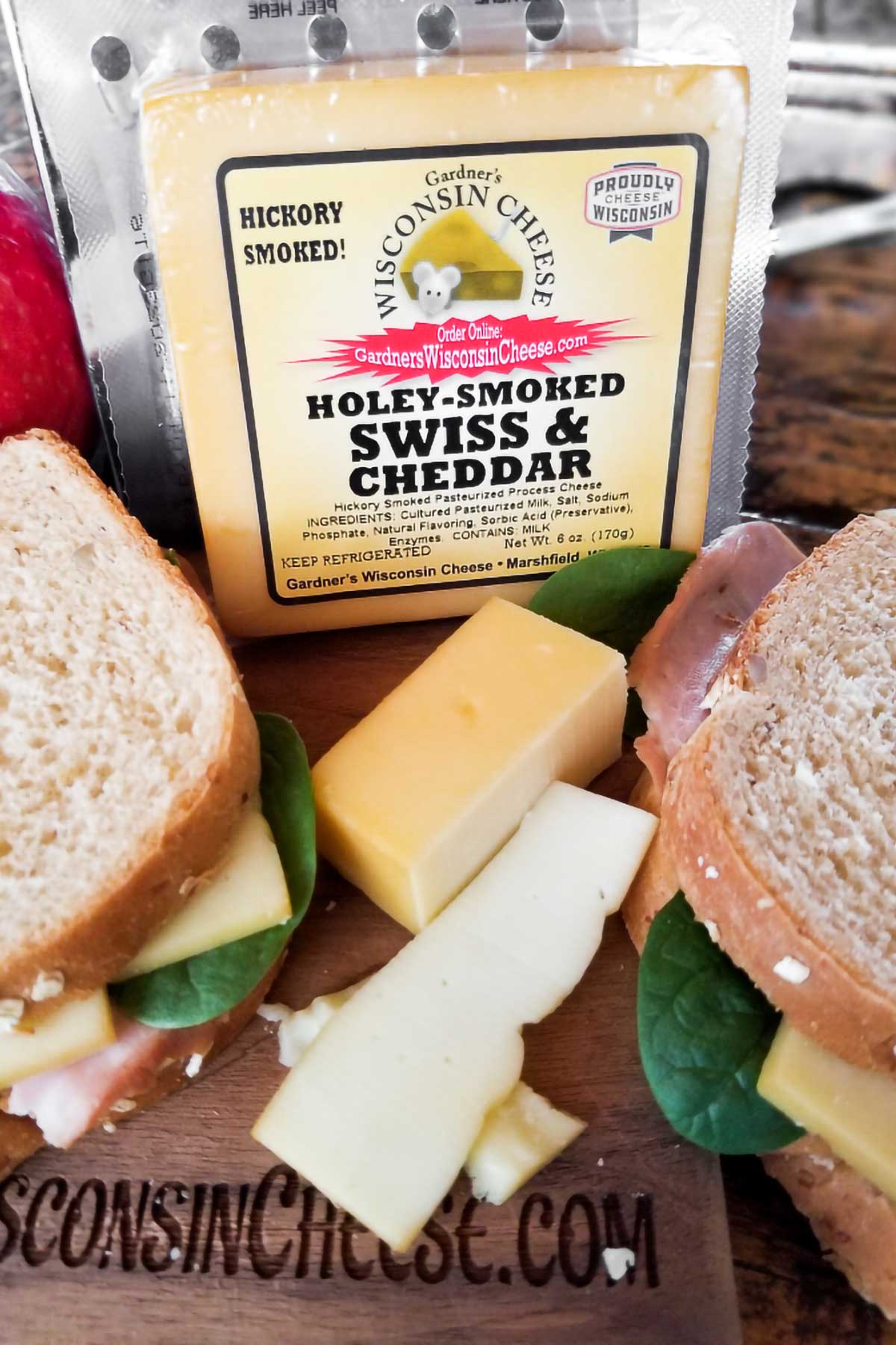 https://www.gardnerswisconsincheese.com/cdn/shop/products/gardners-wisconsin-cheese-and-sausage-cheese-holey-smoked-swiss-cheddar-new-flavor-37074004246773_1600x.jpg?v=1665087879