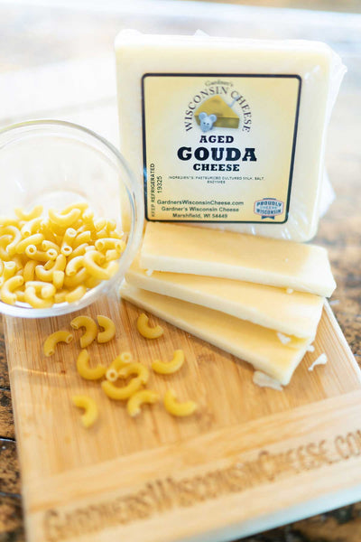 https://www.gardnerswisconsincheese.com/cdn/shop/products/gardners-wisconsin-cheese-cheese-aged-gouda-37031814365429_grande.jpg?v=1665087959