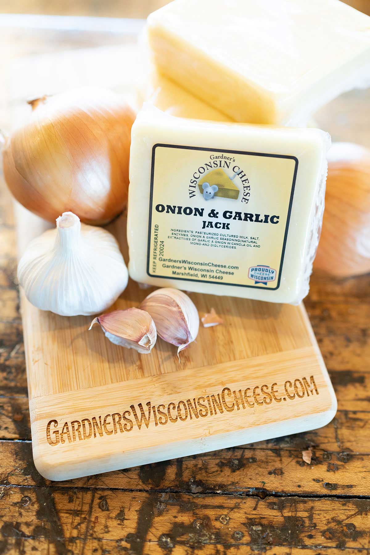 https://www.gardnerswisconsincheese.com/cdn/shop/products/gardners-wisconsin-cheese-cheese-onion-garlic-jack-37032244478197_1600x.jpg?v=1665087959