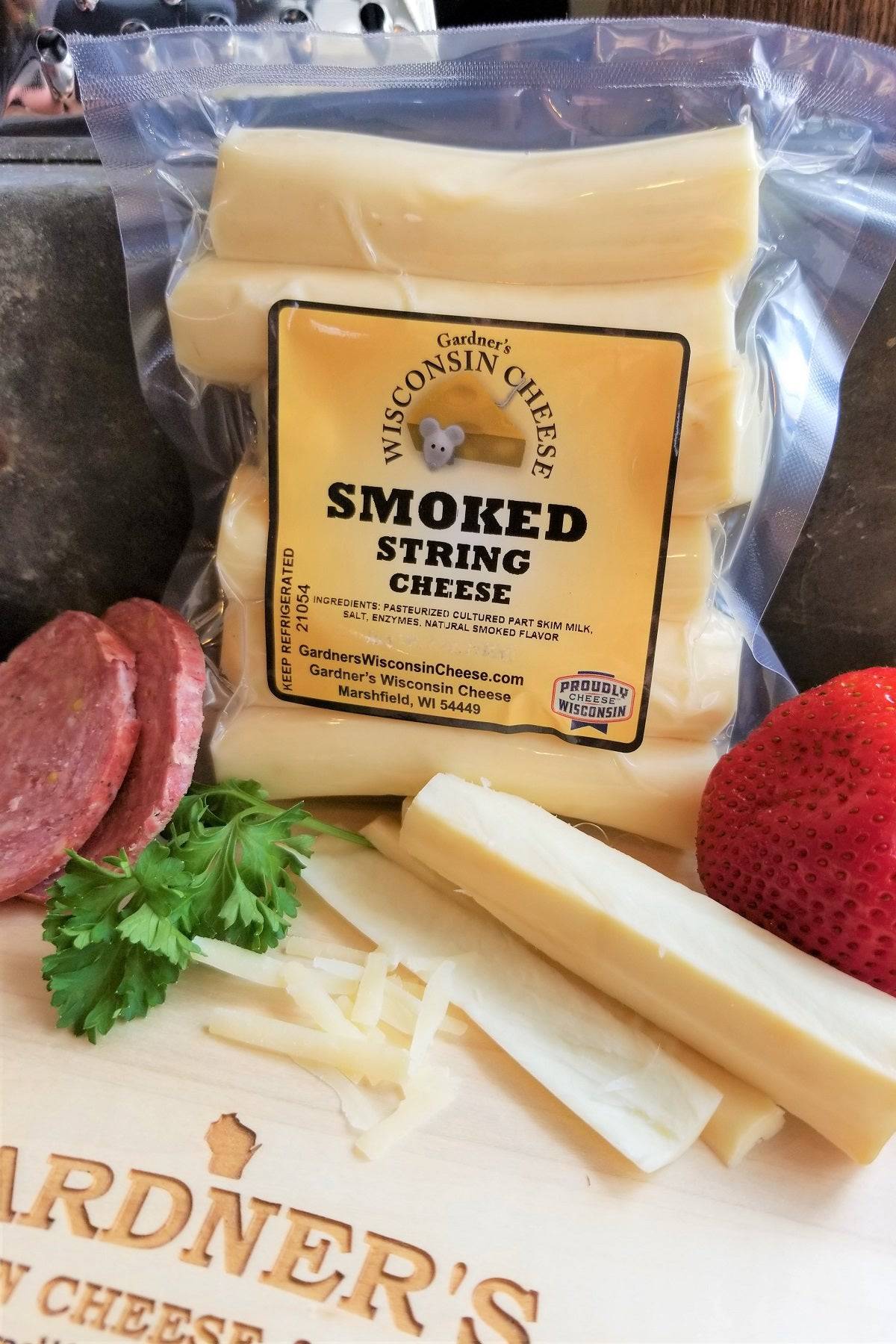 https://www.gardnerswisconsincheese.com/cdn/shop/products/gardners-wisconsin-cheese-cheese-smoked-string-cheese-30886699499712_1600x.jpg?v=1665087900